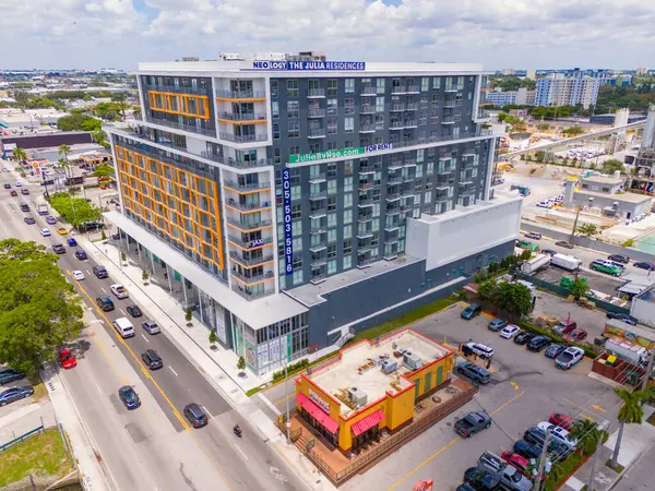 stock image Miami, FL, USA - May 31, 2024: The Julia Residences by Neo Miami. Aerial drone photo modern apartment building mixed use