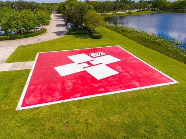 stock image Hospital helicopter landing area. Red painted H helipad