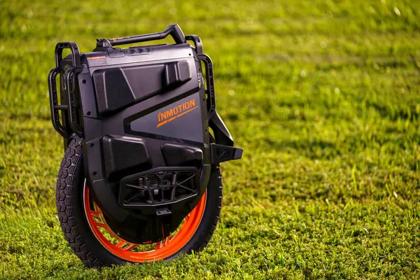 stock image Sunrise, FL, USA - September 24, 2024: Photo of a Inmotion v13 Pro electric unicycle in black and orange