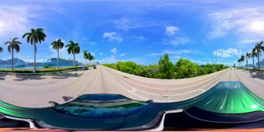 8k 360 drive Miami Beach Macarthur Causeway heading west to downtown. Port of Miami view on left