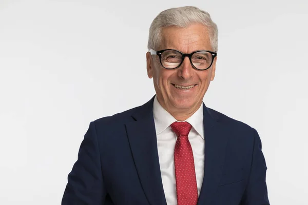 Old Businessman Smiling Camera Wearing Eyeglasses Navy Suit Red Tie — Stock Photo, Image