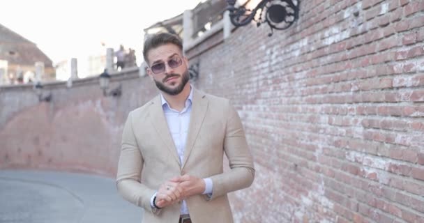 Elegant Fashion Man Looking Side Adjusting Glasses Suit While Posing — Stock Video