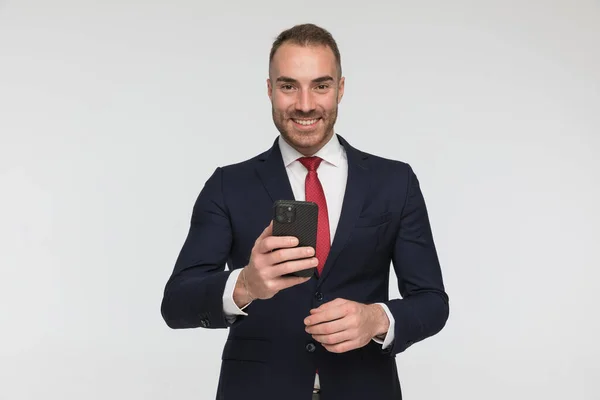 Happy Businessman Suit Holding Phone Reading Emails Being Proud Posing — Stock fotografie