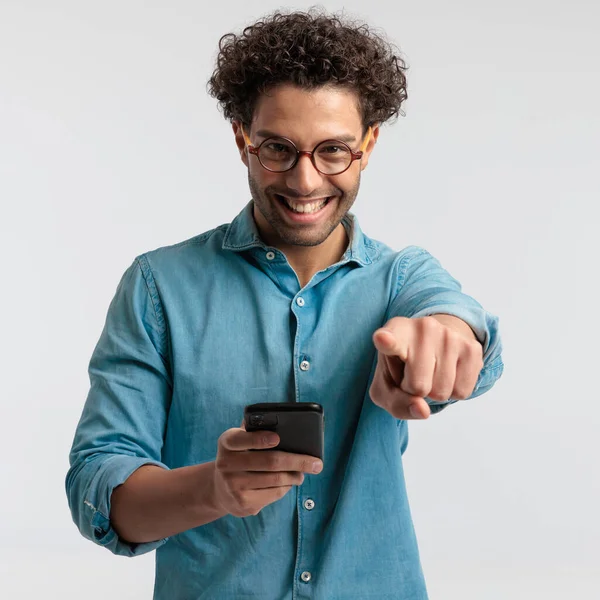 Portrait Sexy Casual Man Texting His Phone Pointing Camera Standing — Stockfoto