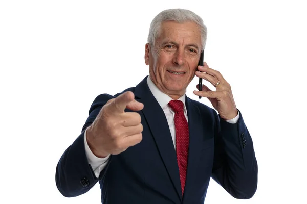 Businessman Talking Phone Pointing Camera — Zdjęcie stockowe