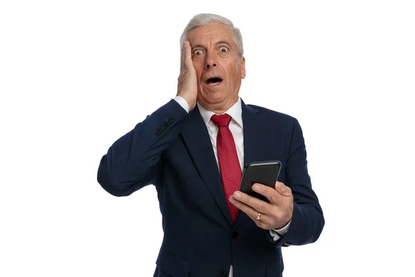 Old Businessman Slapping His Face Feeling Utterly Shocked While Holding — Stockfoto