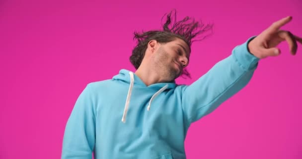 Happy Young Man Curly Hair Wearing Blue Hoodie Holding Arms — Vídeo de stock