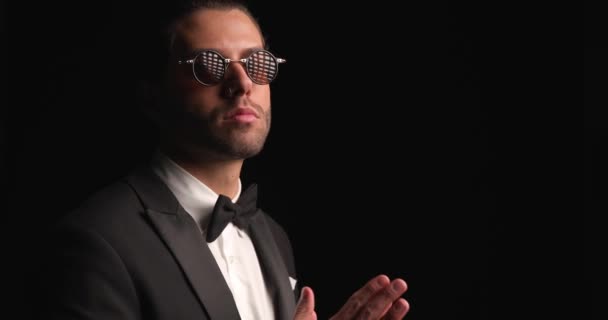 Elegant Businessman Black Tuxedo Sunglasses Touching Palms Fixing Tux Walking — Stok video