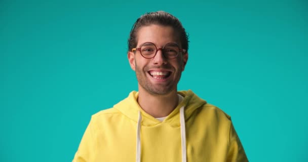 Shy Young Casual Nerd Man Yellow Sweatshirt Wearing Eyeglasses Smiling — Stock video