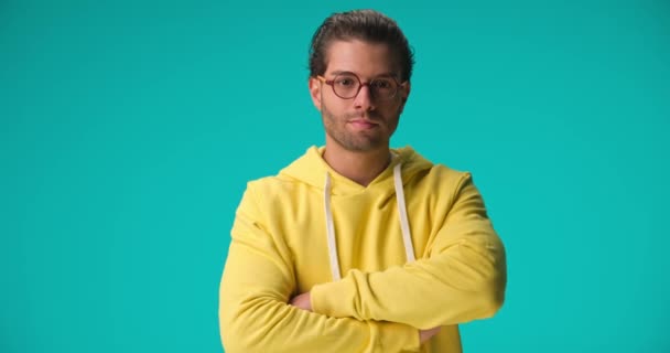 Handsome Greek Man Yellow Hoodie Glasses Crossing Arms Smiling Nodding — Stock video