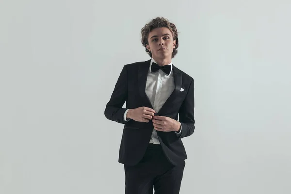 Sexy Man Curly Hair Wearing Adjusting Elegant Black Tuxedo While — стоковое фото