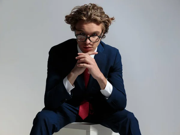Portrait Sexy Seated Businessman Long Curly Hair Holding Elbows Knees — Stock Photo, Image