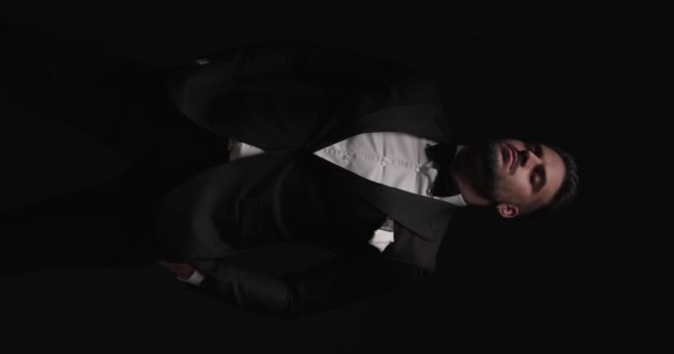Elegant Man Black Tuxedo Bowtie Handkerchief Holding Hands Pockets Looking — Video