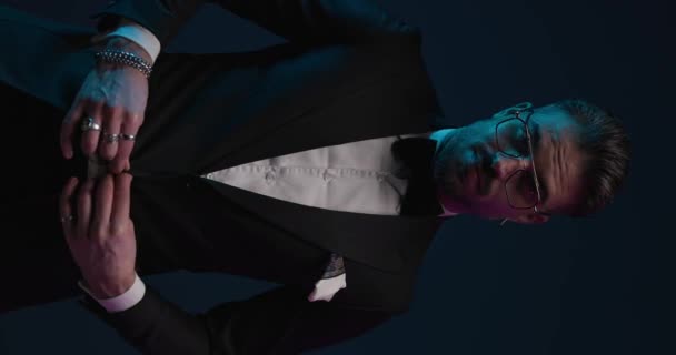 Fashion Elegant Groom Tuxedo Looking Side Adjusting Tux Rubbing Palms — Stock videók