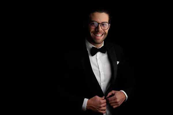 Portrait Handsome Young Groom Glasses Unbuttoning Tuxedo Laughing Front Black — Stock Photo, Image