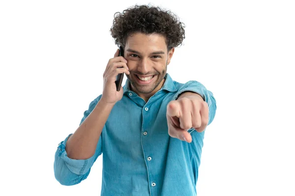 Enthusiastic Arab Man Talking Phone Pointing Finger Front White Background — Stockfoto