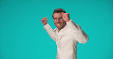 businessman feeling super excited and celebrating success with us