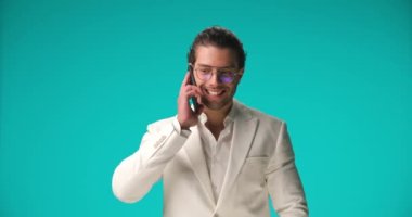 businessman having a good time talking on the phone, laughing a lot