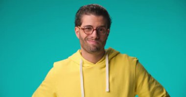 young casual man feeling disappointed to hear the news and slapping his forehead