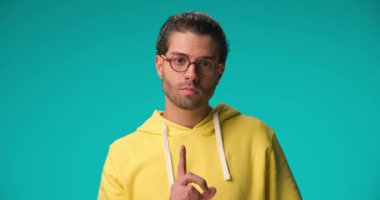 handsome casual man gesturing have patience, you'll see