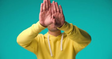 casual man revealing his beautiful smile and crossing his arms