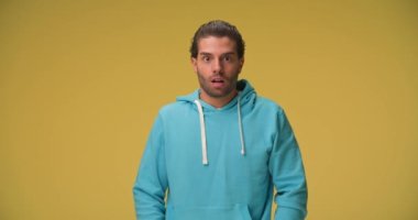 handsome casual man is shocked then arrogant and finally is feeling happy