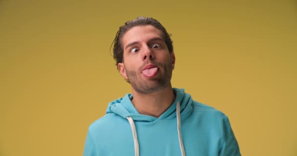 Casual Man Goofing Sticking His Tongue Out Shaking His Head — Stockvideo