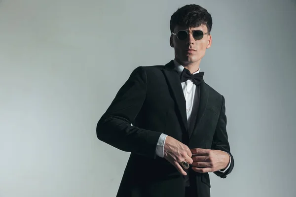 Portrait Handsome Elegant Man Glasses Buttoning Black Tuxedo Posing Confident — Stock fotografie