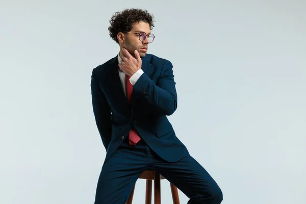 Elegant Businessman Touching His Neck Slowly Sitting Chair Wearing Eyeglasses — Stock Photo, Image