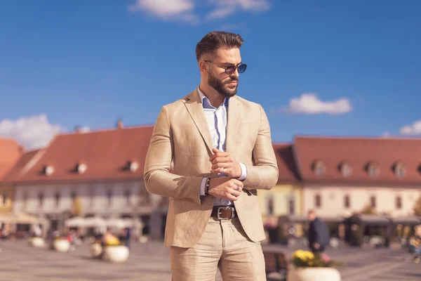 Portrait Attractive Businessman Fixing His Sleeve Looking Away Wearing Sunglasses — Stock Photo, Image