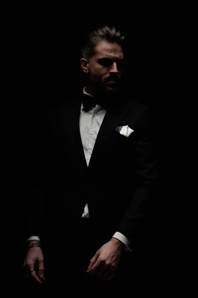 Sexy Unshaved Elegant Man Black Tuxedo Looking Side Posing Mysterious — стоковое фото