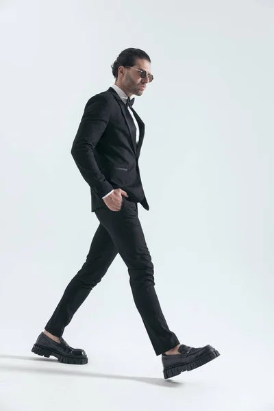 Elegant Young Businessman Black Tuxedo Walking Looking Side While Holding — Stock Photo, Image