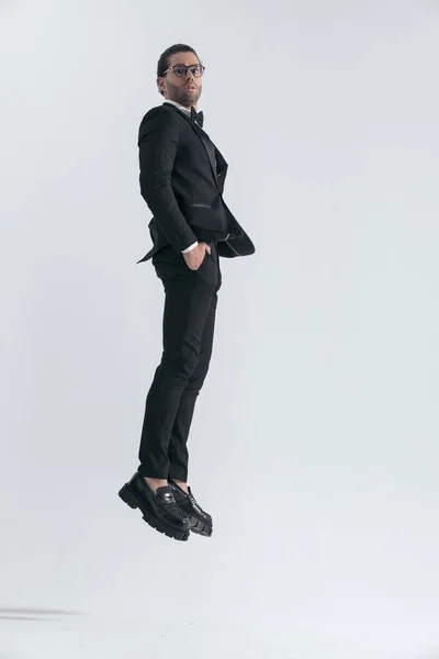 Side View Sexy Fashion Man Tuxedo Jumping Air Hands Pockets — Stock Photo, Image