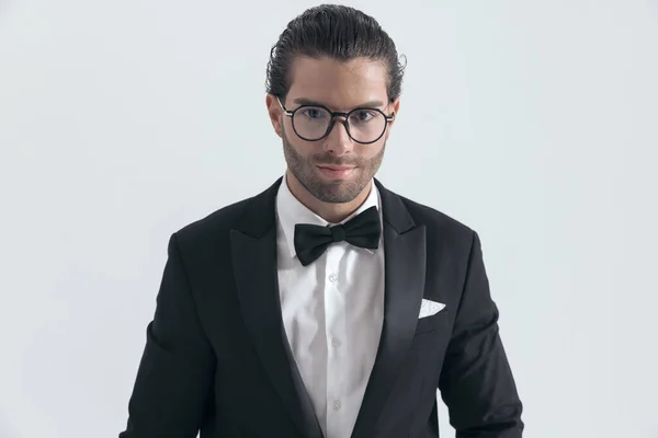 Portrait Happy Businessman Black Tuxedo Glasses Smiling Posing Front Grey — Stock Photo, Image