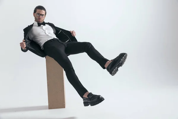 Fashion Elegant Guy Pulling Black Tuxedo Jacket Posing Legs Air — Stock Photo, Image