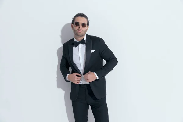 Handsome Businessman Opening His Tuxedo Posing Wearing Glasses White Studio — Stock Photo, Image
