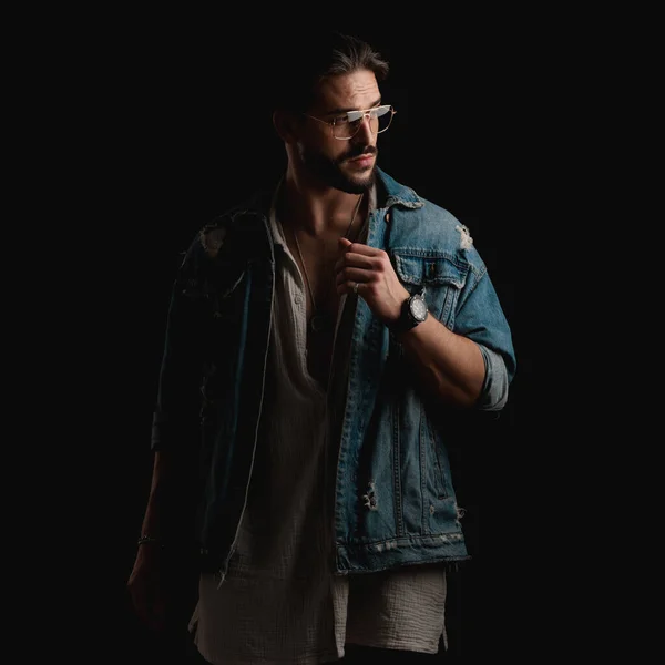 Sexy Bearded Guy Glasses Wearing Denim Jacket Looking Side While — Stock Photo, Image