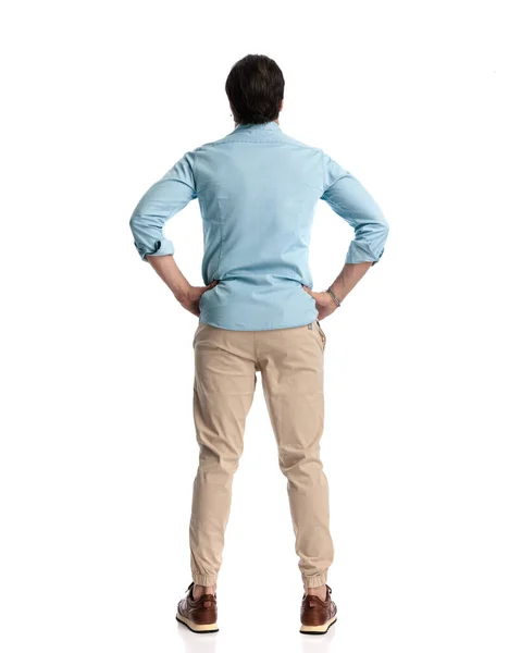Back View Casual Young Man Holding Hands Hips Looking Forward — Stock Photo, Image