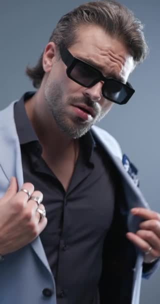 Attractive Elegant Man Sunglasses Looking Side While Buttoning Suit Looking — Stock Video