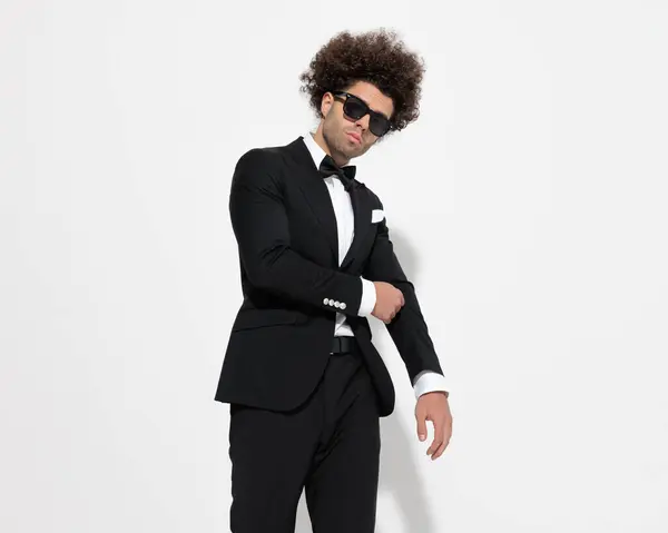 Sexy Curly Hair Guy Sunglasses Adjusting Tux Jacket Being Cool — Stock Photo, Image