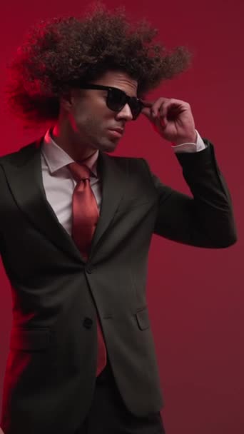 Sexy Curly Hair Man Sunglasses Looking Side Fixing Sunglasses Sensually — стоковое видео