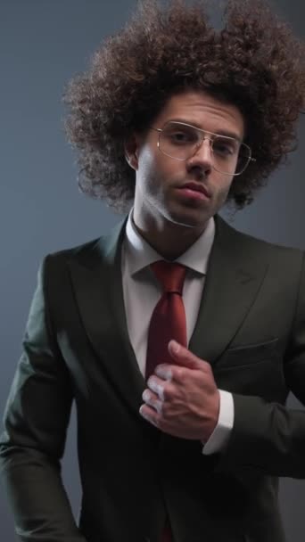 Curly Hair Businessman Glasses Adjusting Black Suit Looking Side Front — Stock Video