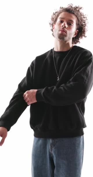 Sexy Casual Man Curly Hair Adjusting Sweatshirt Sleeves Collar While — стоковое видео