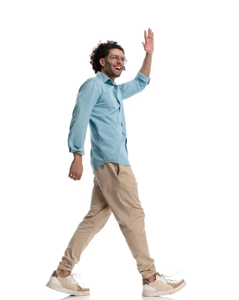 Side View Young Casual Man Walking Making Hello Gesture Isolated — Stock Photo, Image