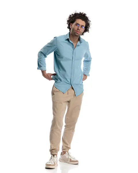 Sexy Young Casual Man Arranging His Blue Shirt While Standing — Stock Photo, Image