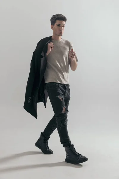 Stylish Young Man Holding Black Coat Shoulder Walking Side Gray — Stock Photo, Image