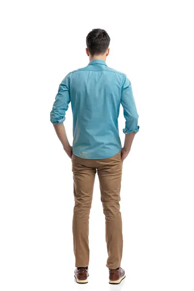 Rear View Relaxed Casual Man Wearing Blue Shirt Jeans Holding Royalty Free Stock Images