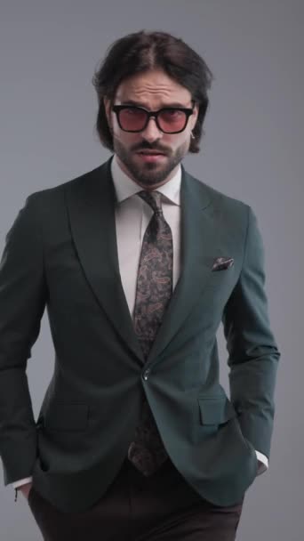 Confident Businessman Sunglasses Walking Adjusting Elegant Suit Holding Hands Pockets — Stock Video