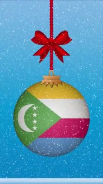 Komoros bayrağıyla Noel balosuna kar yağıyor.