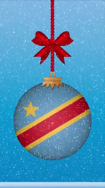 挂着刚果民主共和国国旗的圣诞球上飘着雪 — 图库视频影像